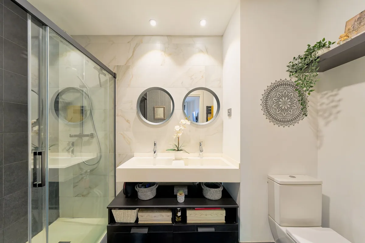 Contemporary bathroom with glass shower and wide white vanity