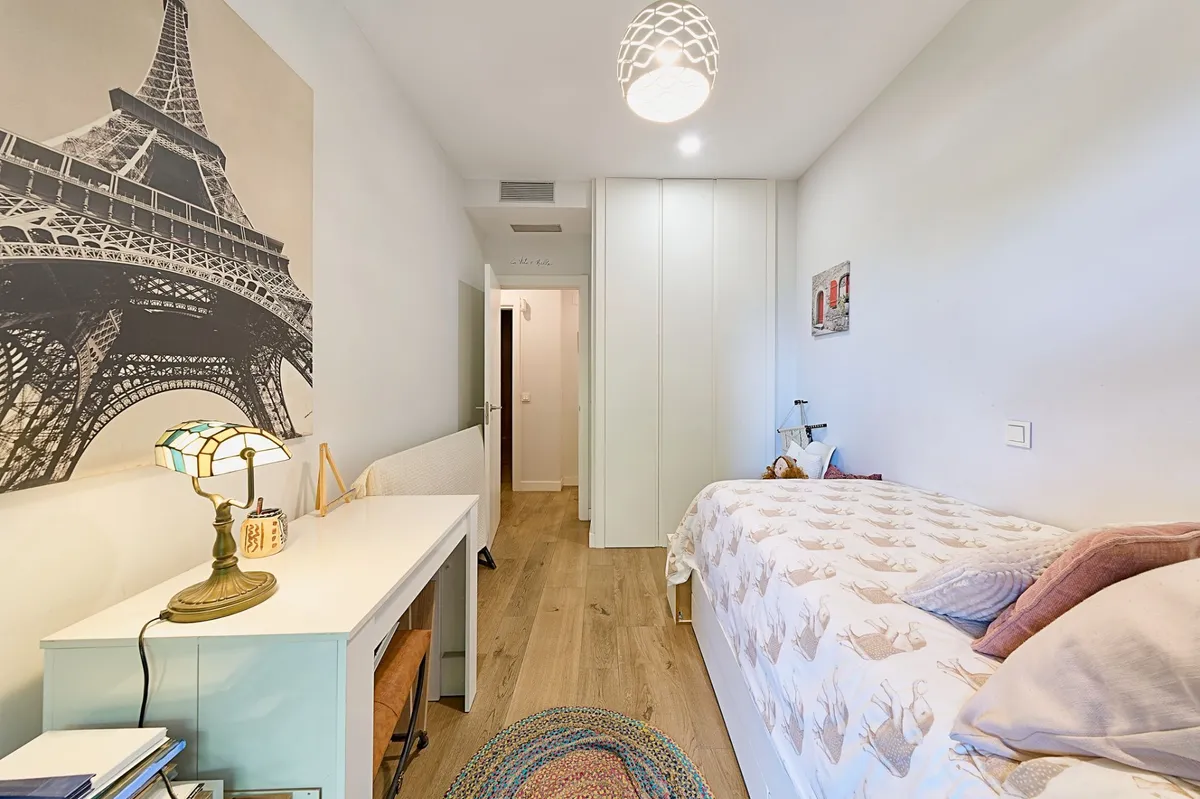 Third bedroom with Paris mural, fitted wardrobe and study desk