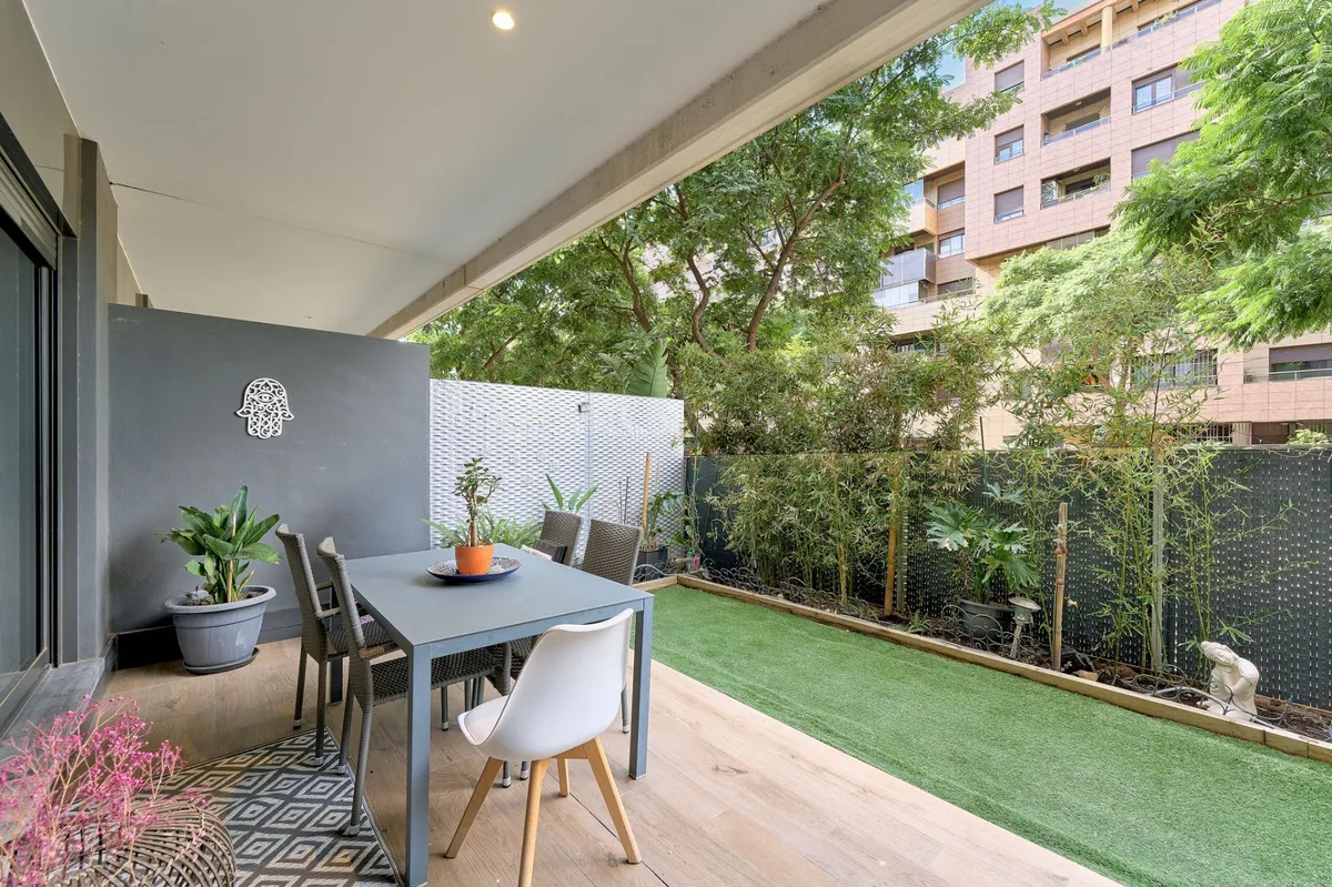 Sheltered private terrace dining area overlooking mature greenery