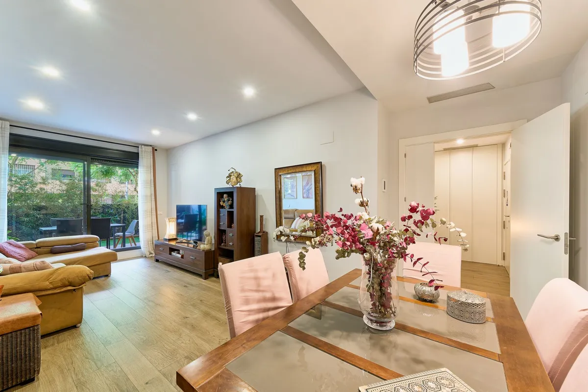 Bright living and dining room opening onto the garden terrace