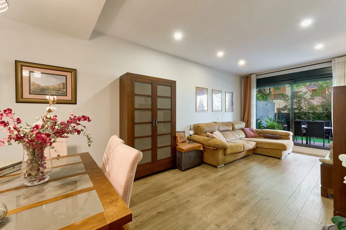 Elegant dining table and lounge with wide terrace doors
