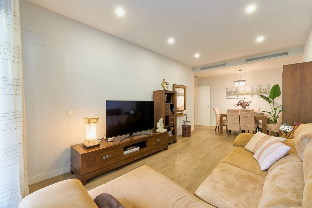 Comfortable main lounge with sectional sofa and large television