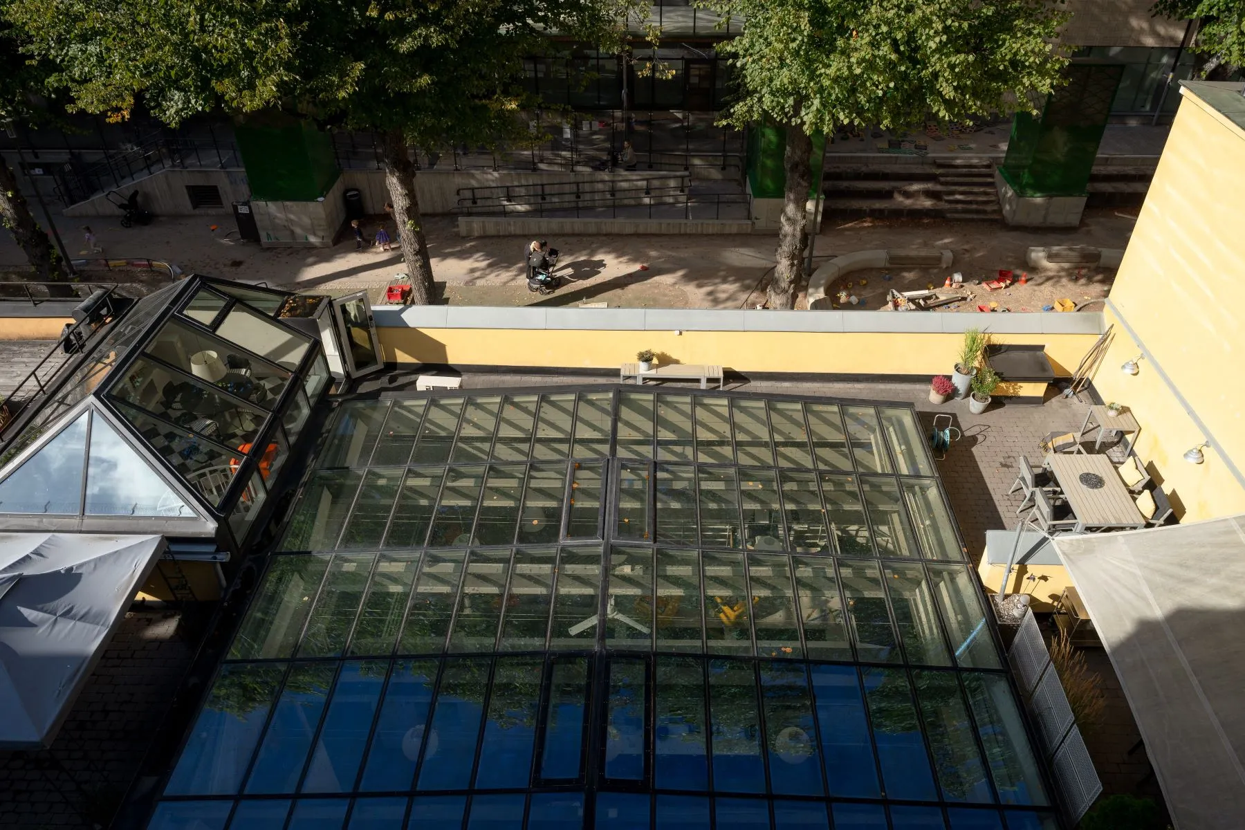 Elevated courtyard view across the conservatory roof and secluded terrace