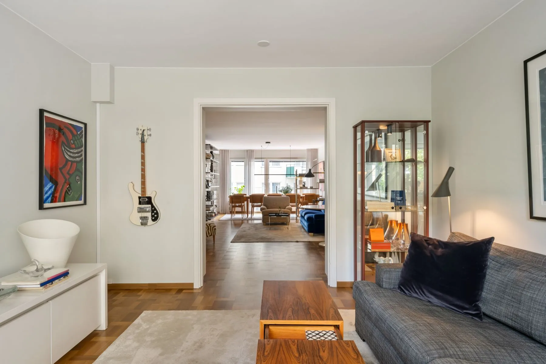 Quiet secondary lounge with courtyard outlook and guitar wall display