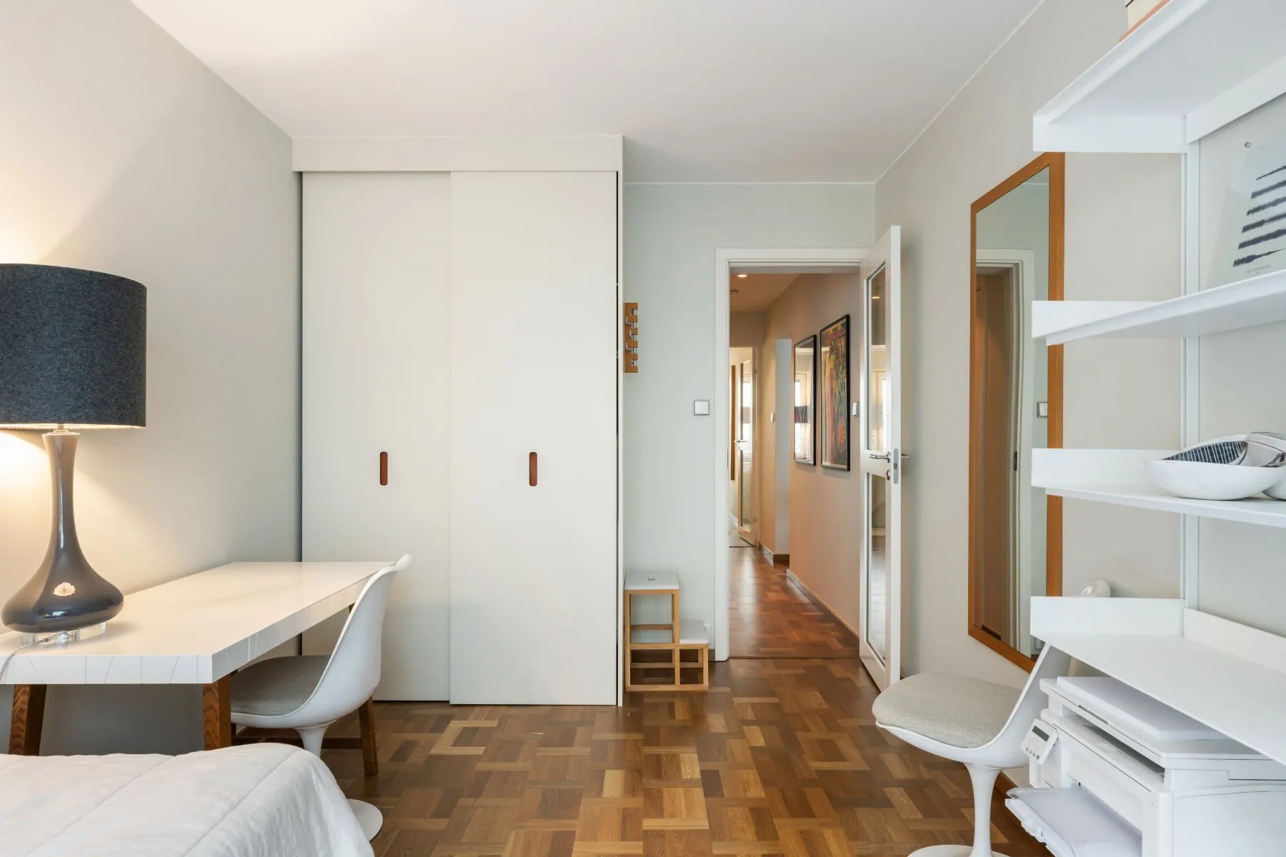 Second bedroom with fitted wardrobes, shelving and practical workspace