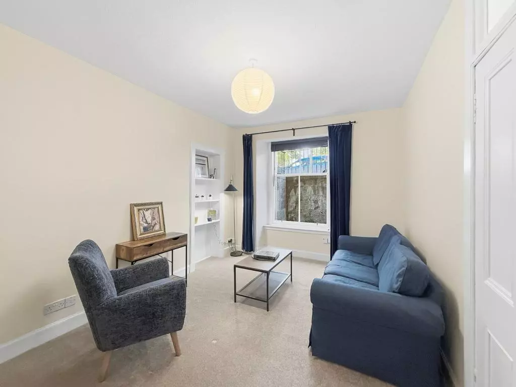 Comfortable living room with sofa, armchair and coffee table