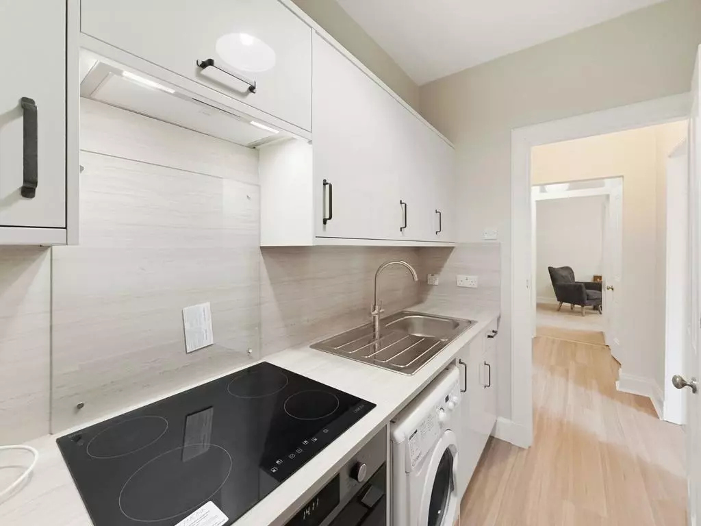 Separate fitted kitchen with oven, hob and washing machine