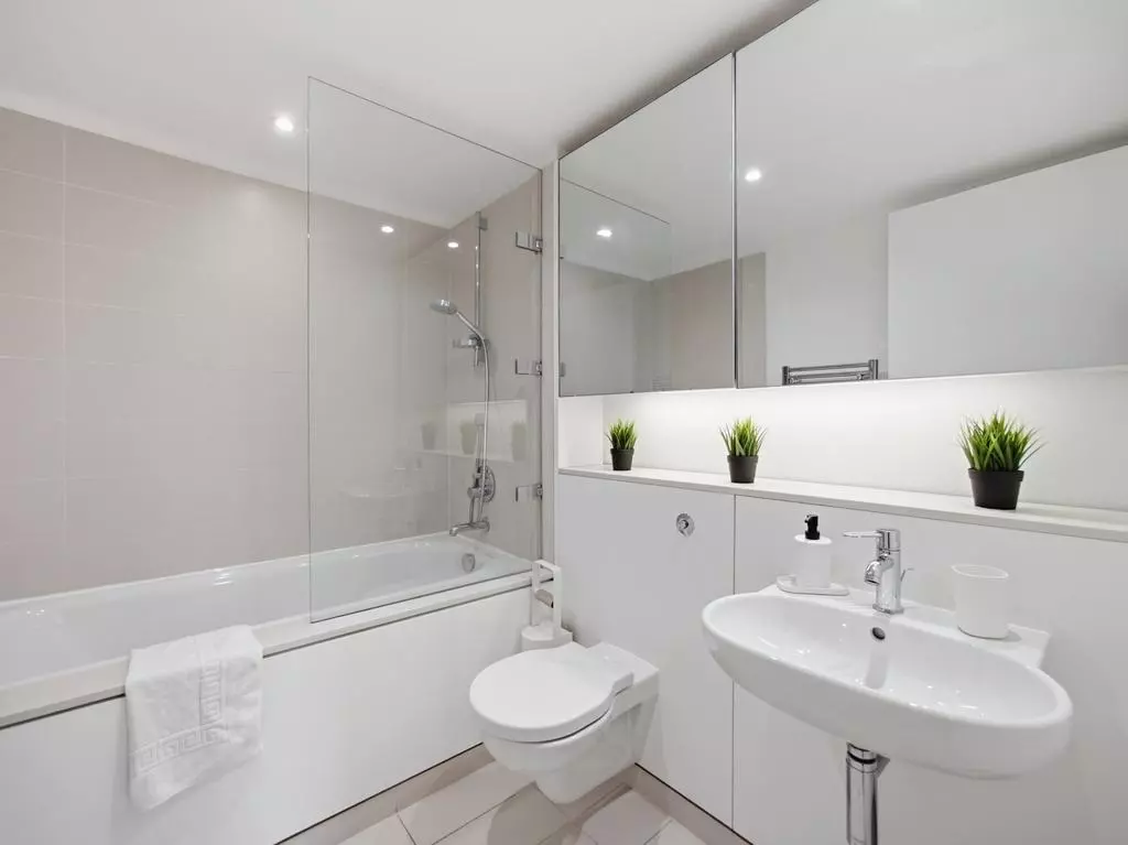 Modern family bathroom with shower over the bathtub