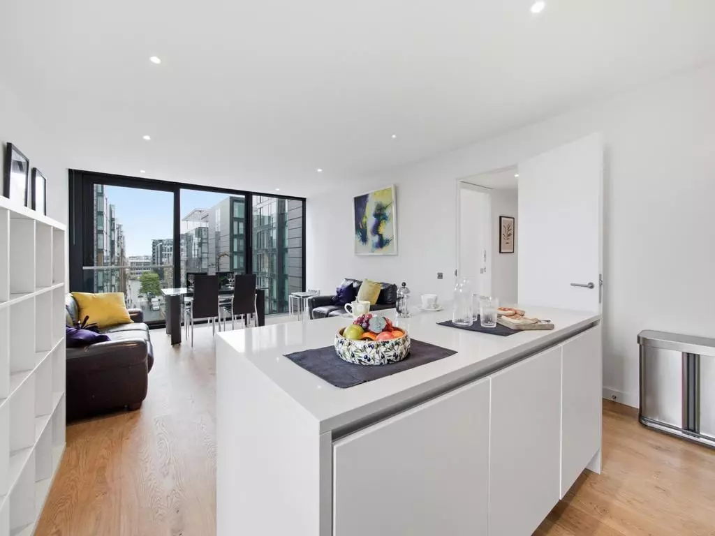 Kitchen island opening into the dual-aspect living space
