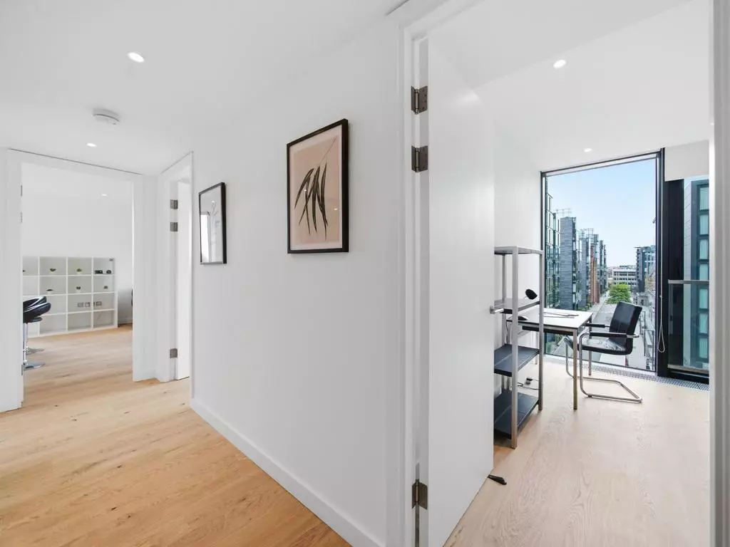 Entrance hallway with storage and views toward the living area