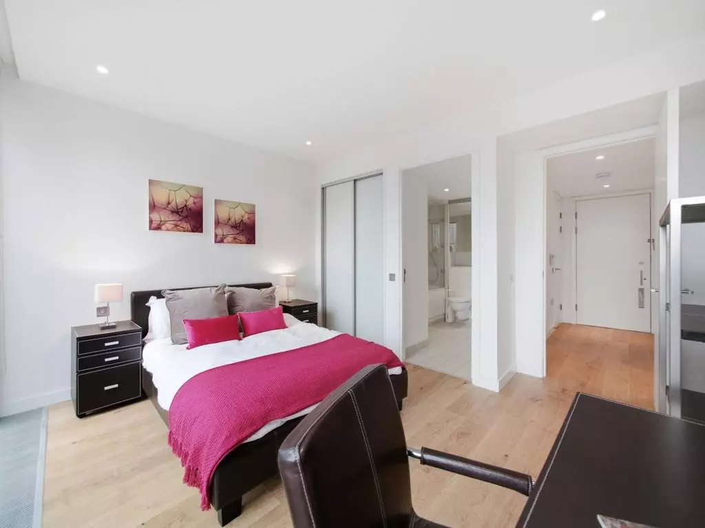 Principal bedroom with built-in wardrobe and en-suite access