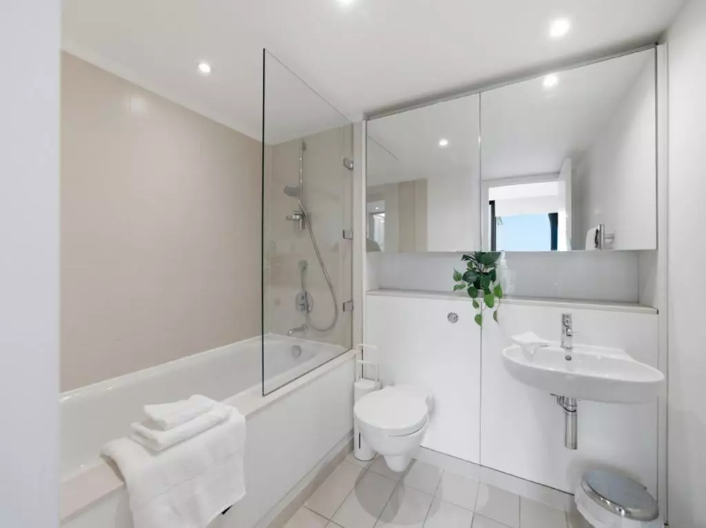 Principal en-suite bathroom with shower over the bathtub