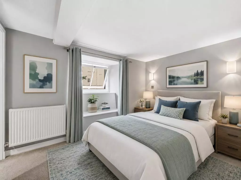 Double bedroom with fitted wardrobe and garden outlook