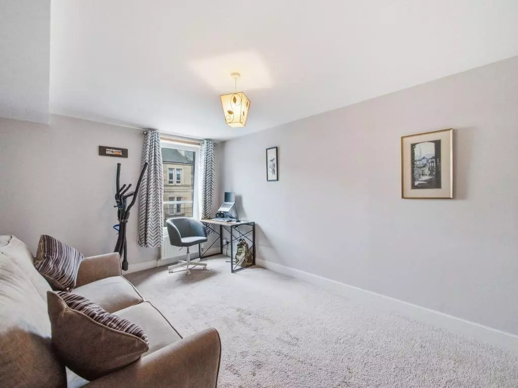 Flexible second bedroom and home office with natural light