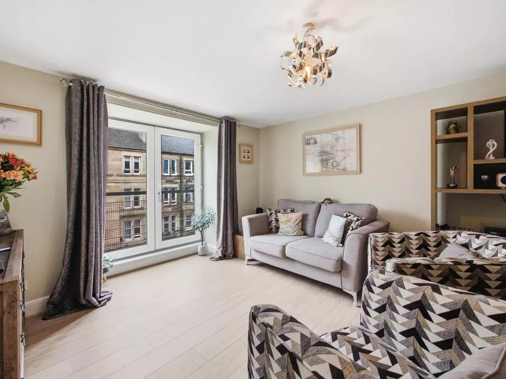 Living room beside the Juliet balcony with Leith street views