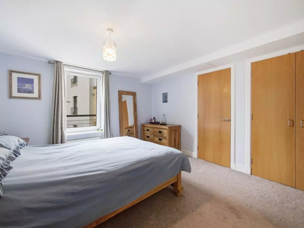 Principal bedroom with full-height built-in wardrobes