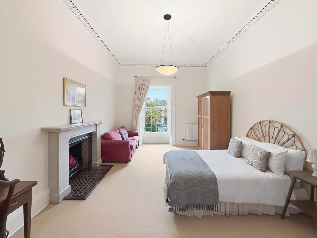 Second double bedroom with decorative fireplace