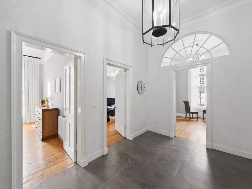 Welcoming entrance hall connecting the Georgian apartment rooms