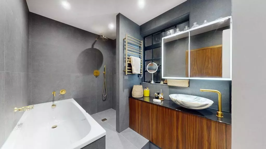 Luxury bathroom with bathtub, walk-in shower and timber vanity