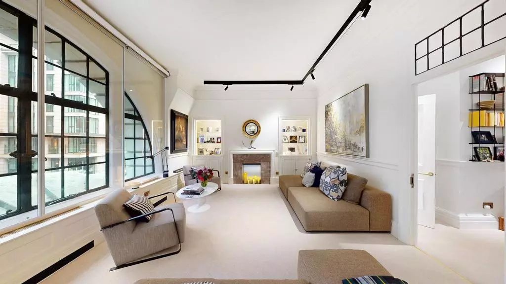 Bright reception room overlooking Baker Street through the arched window