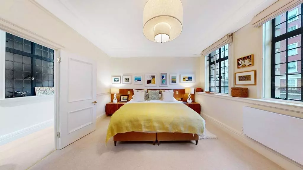 Bright principal bedroom with double bed and generous fitted wardrobes