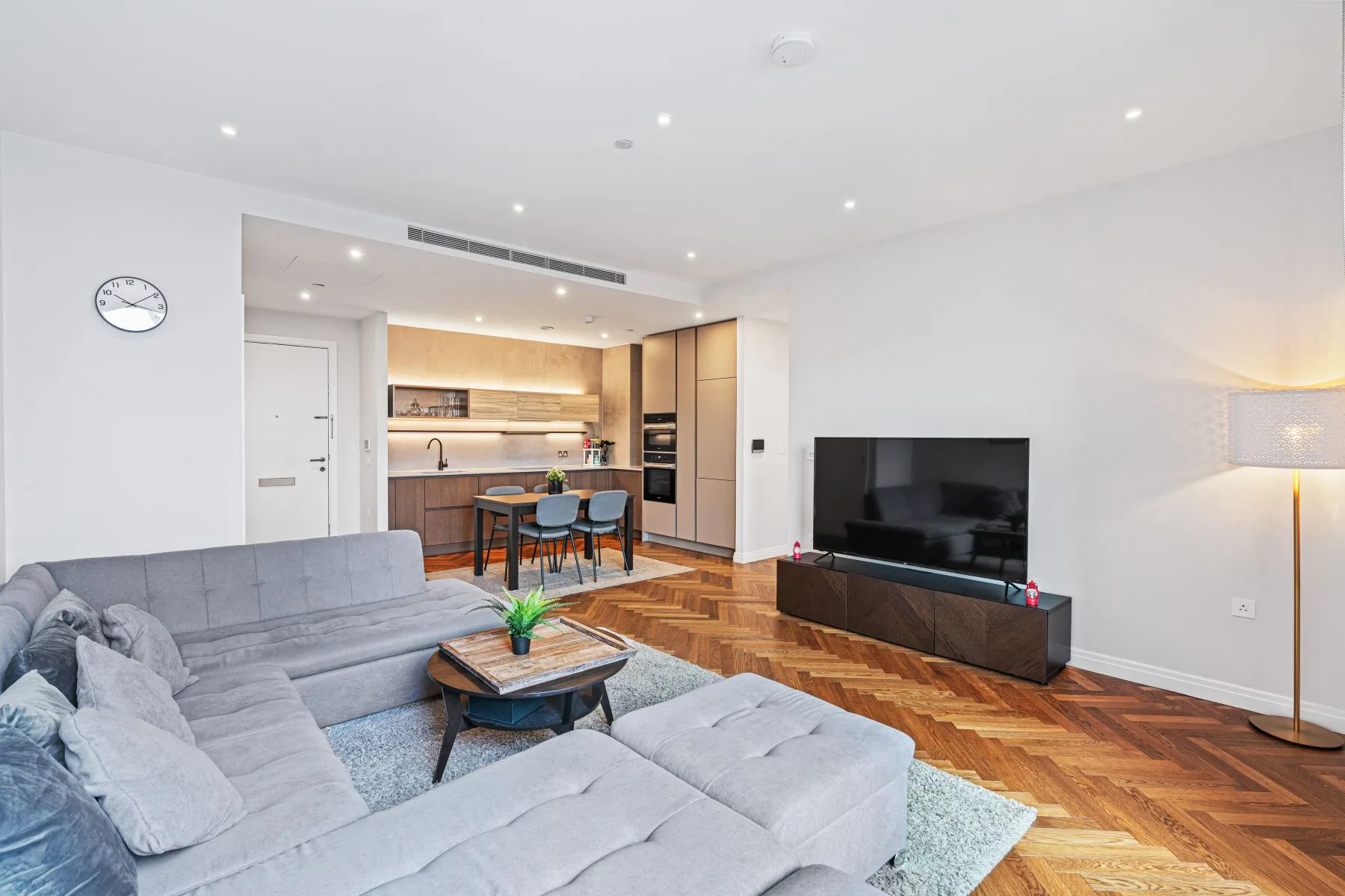 Spacious lounge viewed toward the dining area and premium kitchen