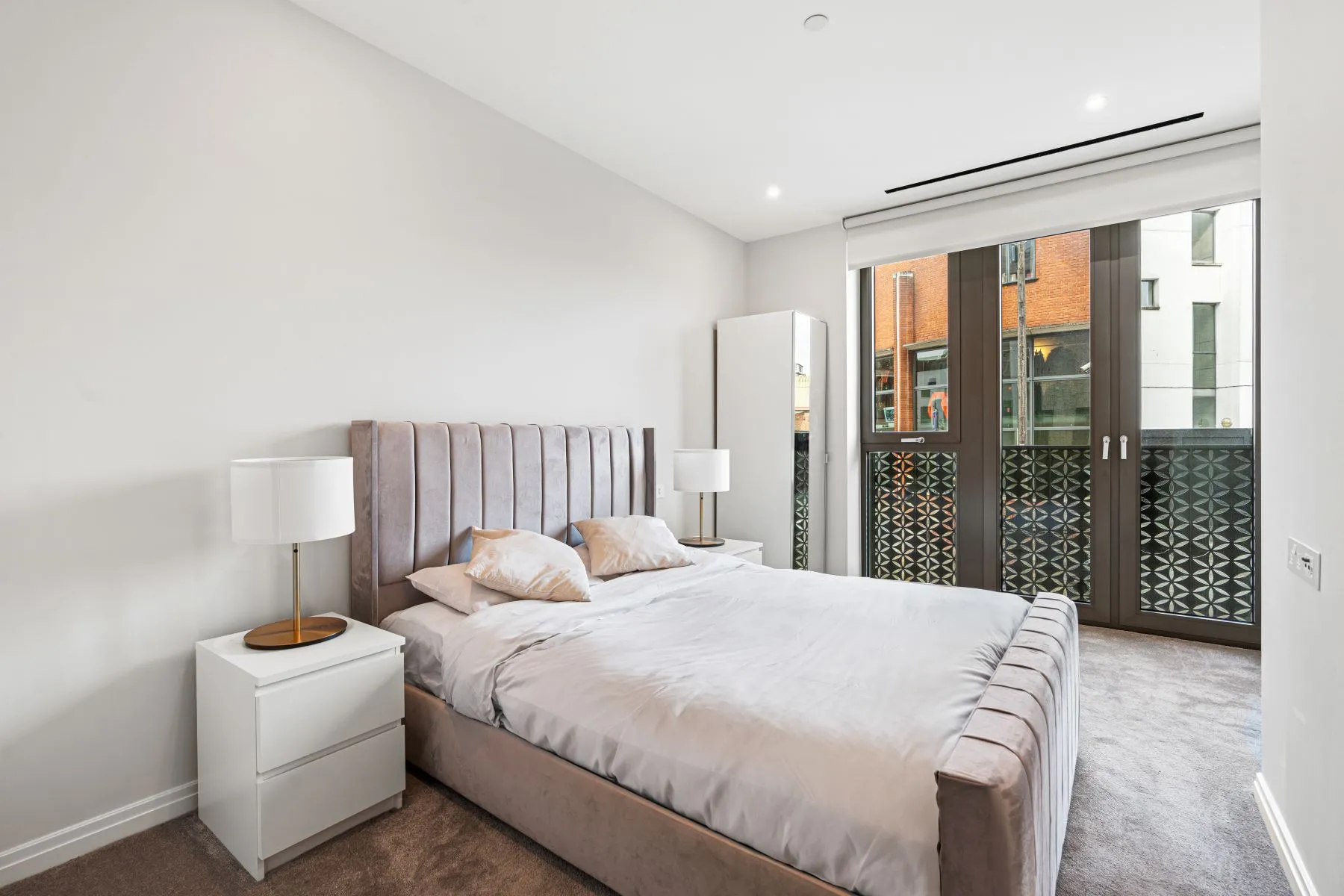 Principal double bedroom with full-height balcony doors